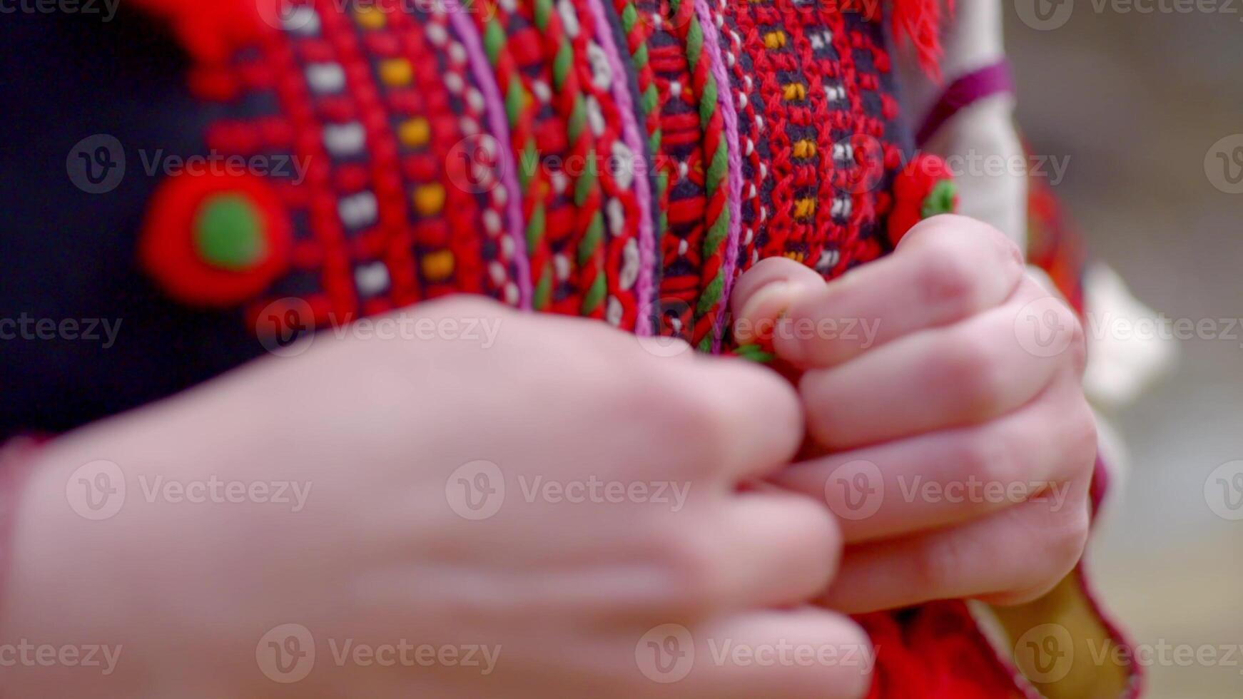 Woman button up on ukrainian traditional costume, photo