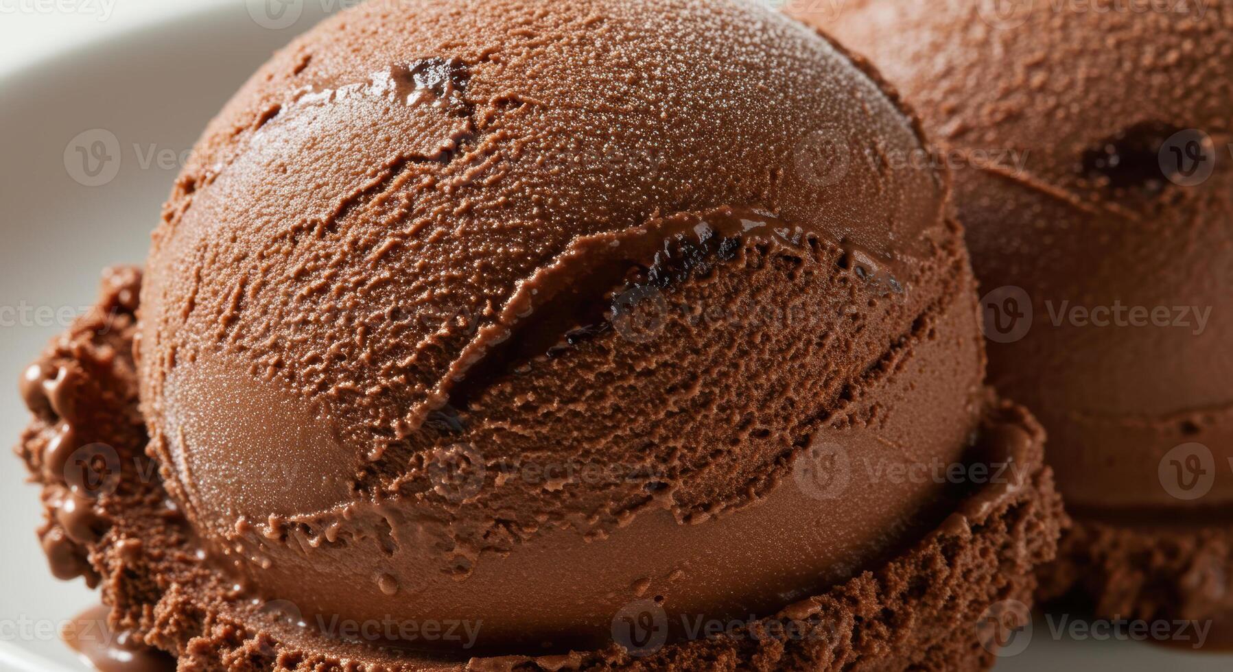 Close up shot of two scoops of rich, smooth chocolate ice cream photo