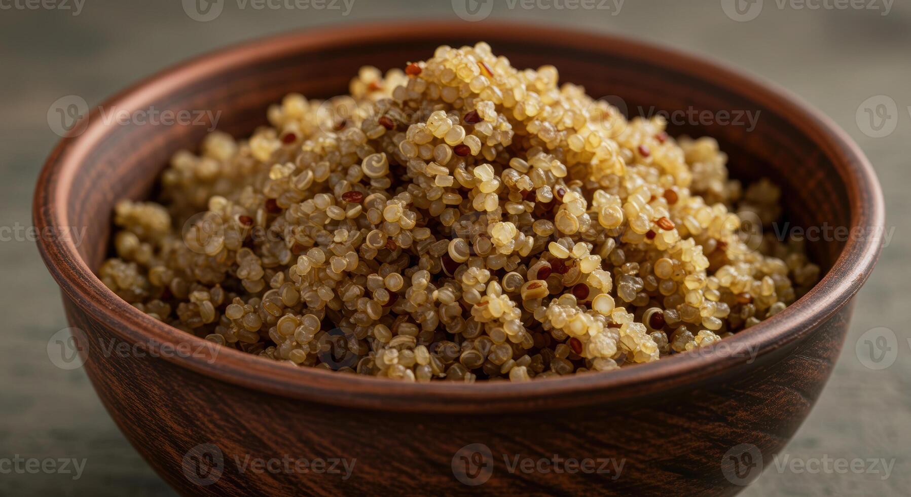 A full, vibrant bowl of freshly cooked quinoa sits ready to be enjoyed. photo