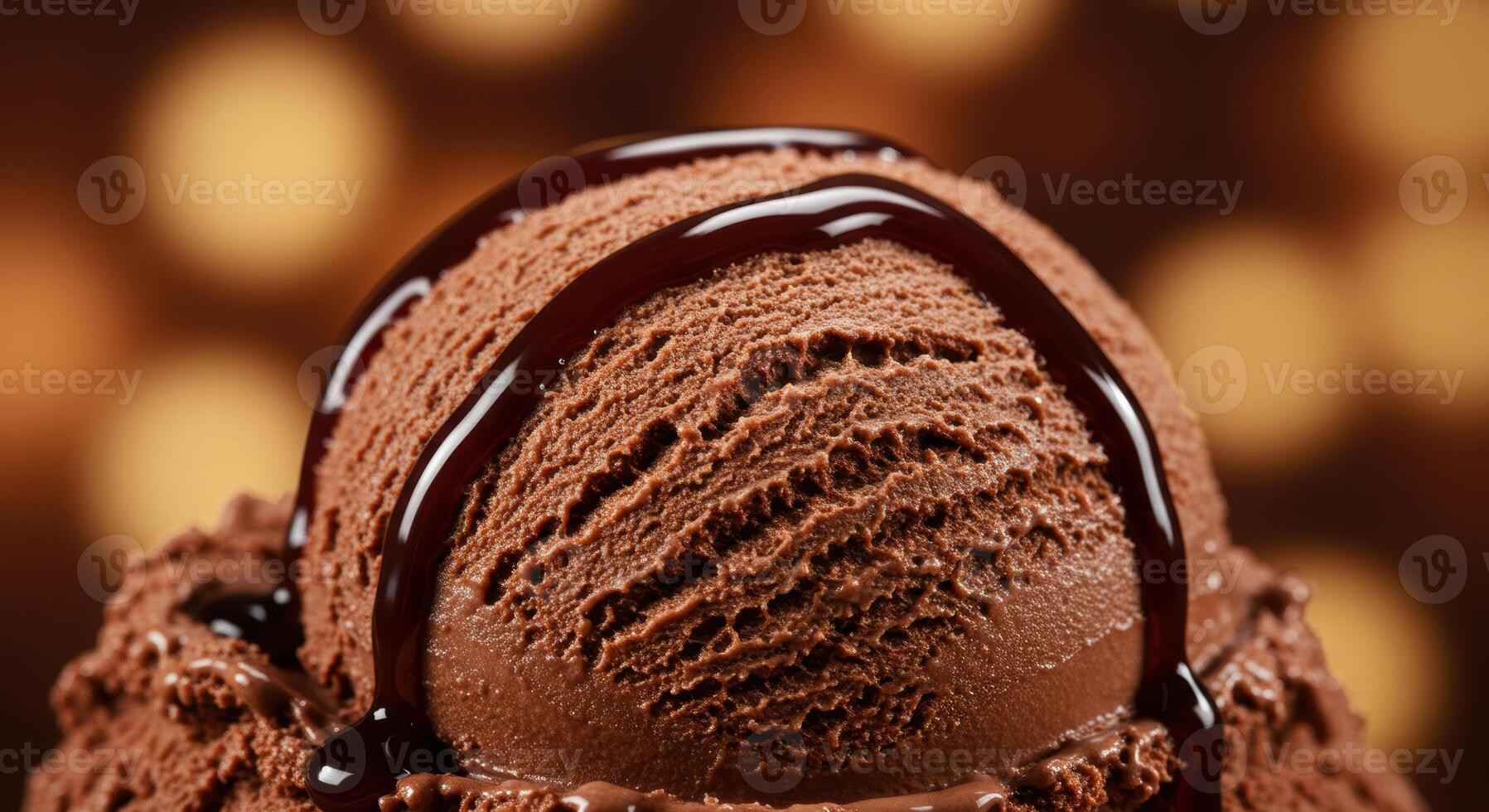 A delightful scoop of chocolate ice cream topped with rich, glistening chocolate syrup. photo