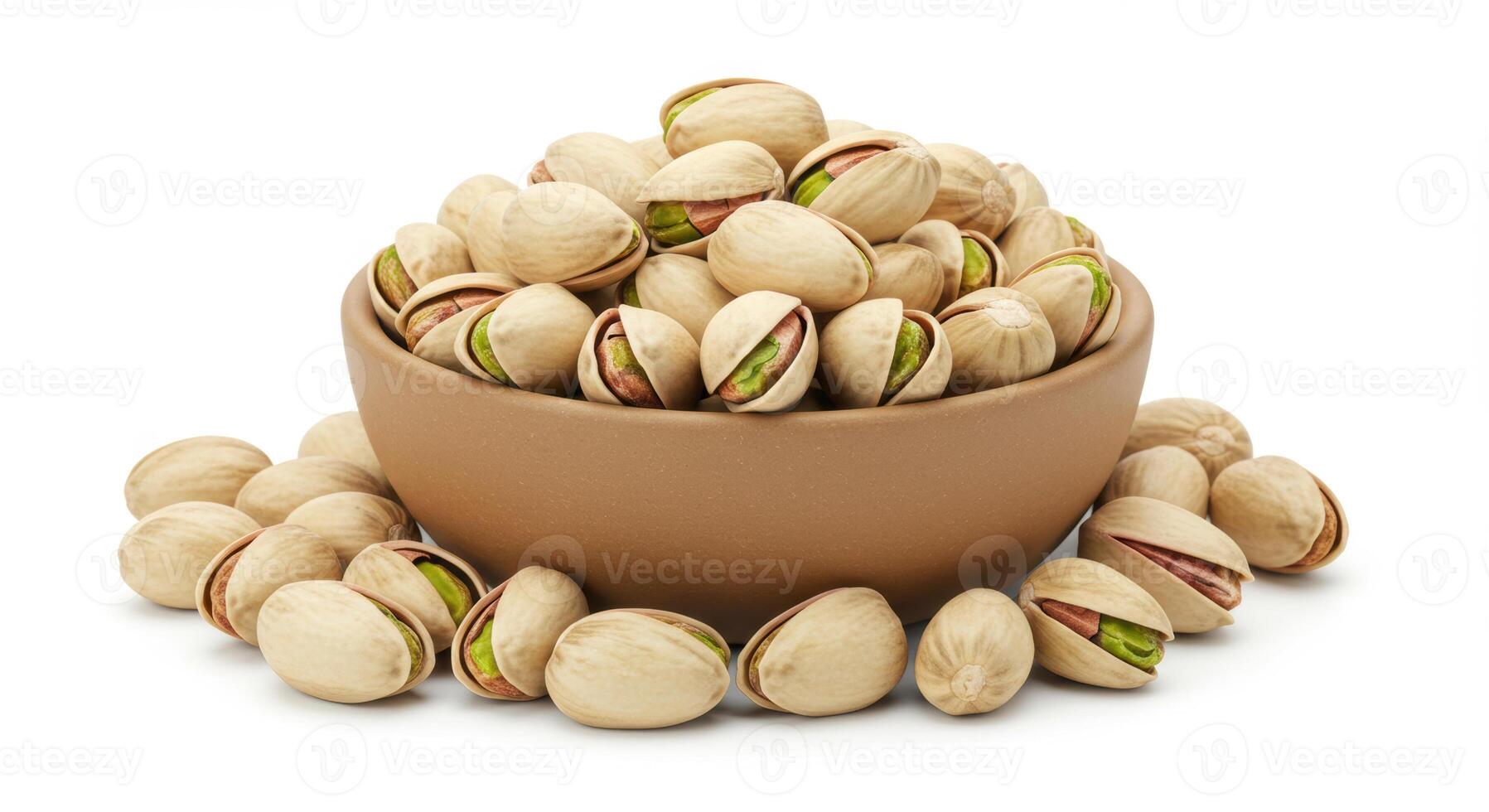 A full ceramic bowl and scattered pistachios on a clean white backdrop, perfect for culinary use. photo