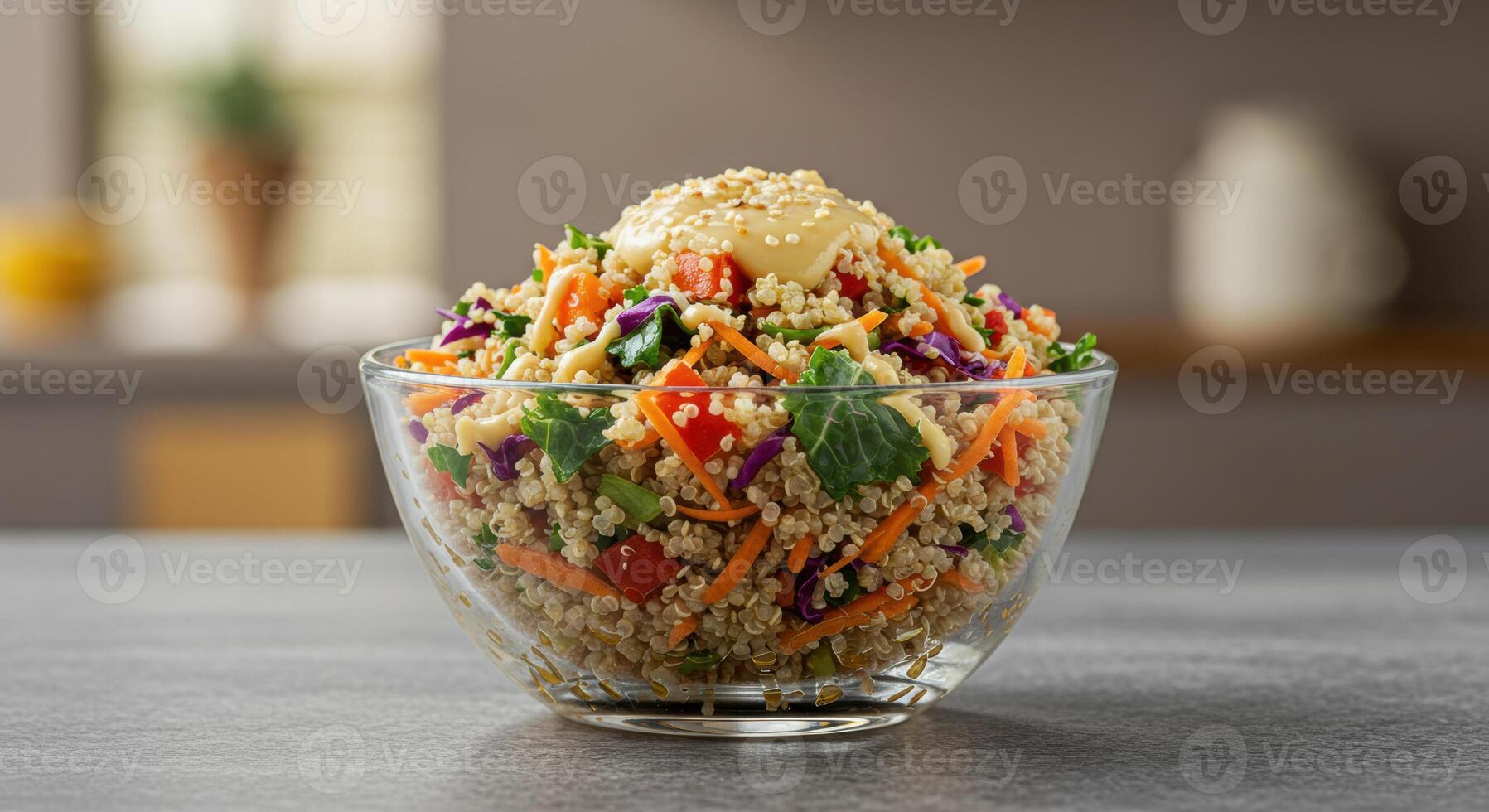 A beautifully presented quinoa salad with an assortment of fresh vegetables and a creamy dressing. photo