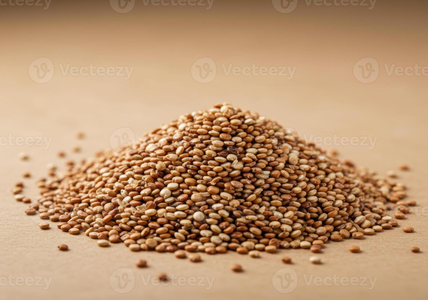 A large mound of quinoa, a nutritious and delicious grain, sits against a brown backdrop. photo
