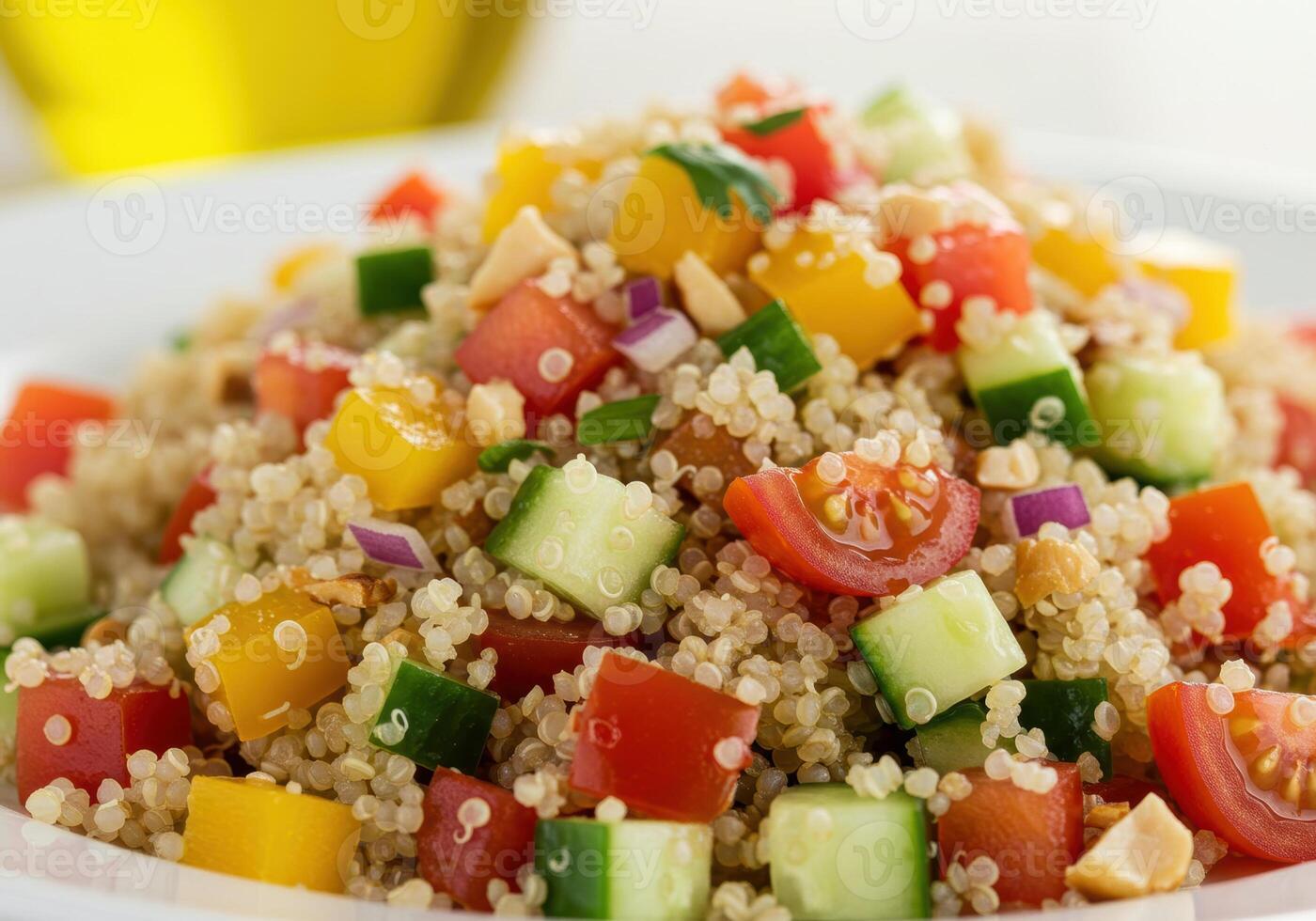 Delicious and vibrant quinoa salad with fresh tomatoes, peppers, and cucumbers, a perfect light meal. photo
