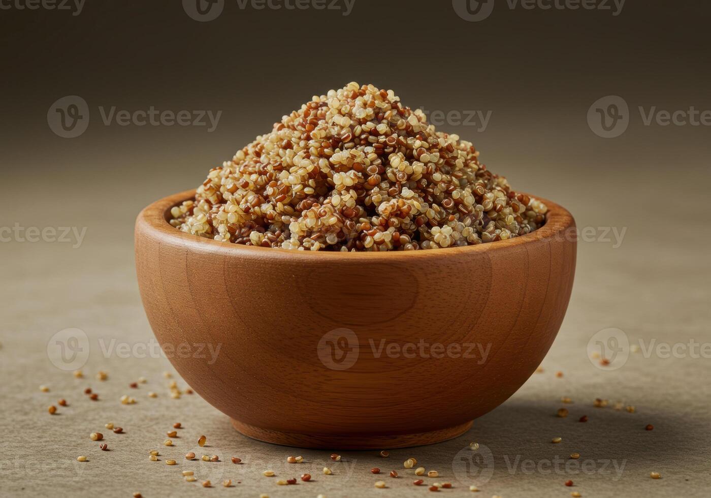 A wooden bowl filled to the brim with fluffy, cooked quinoa grains. photo