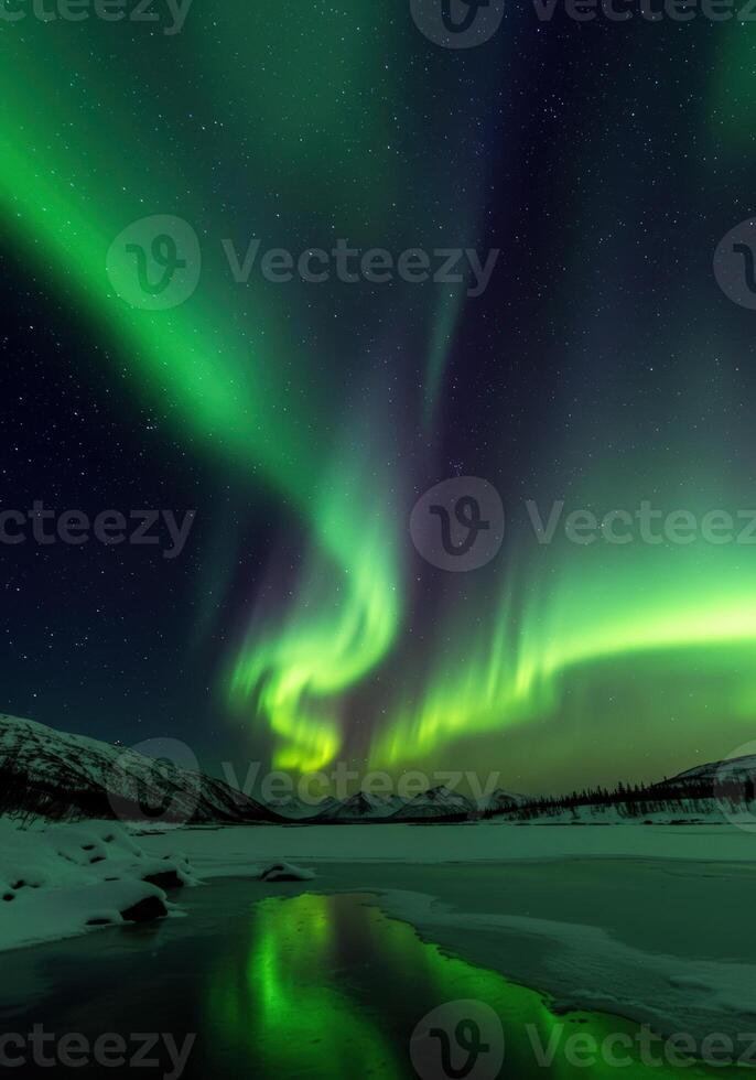A breathtaking view of the aurora borealis illuminating the night sky over a frozen lake. photo