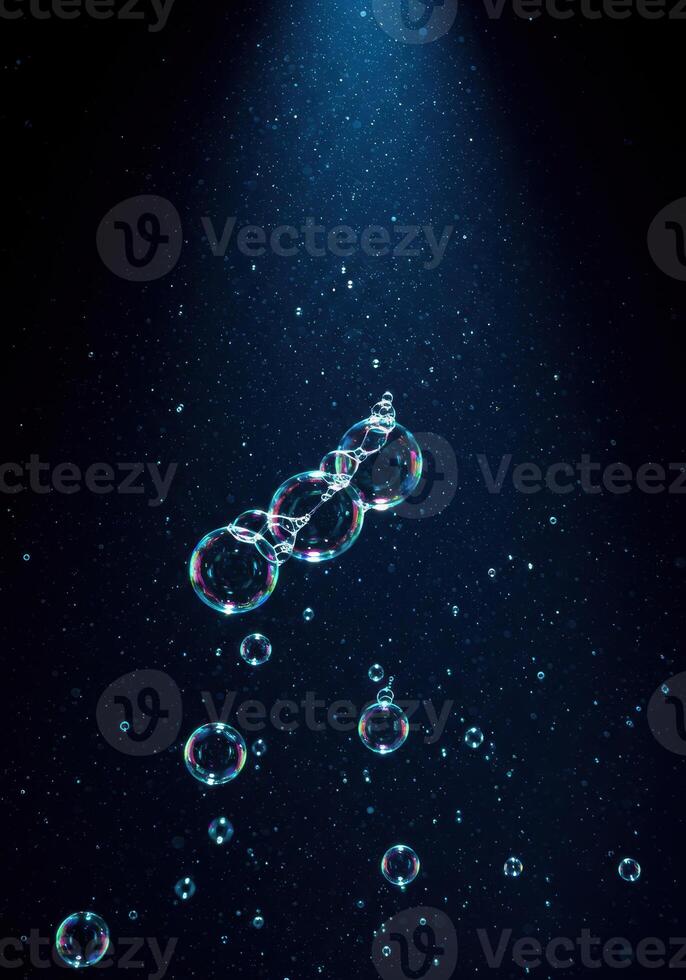 Soap bubbles in a magical scene, with shimmering light and enchanting colors photo
