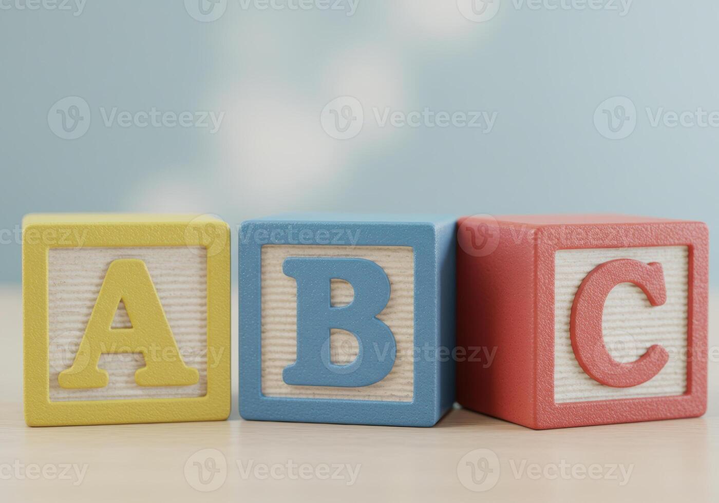 Vibrant wooden blocks displaying the letters A, B, and C in a row against a soft background. photo