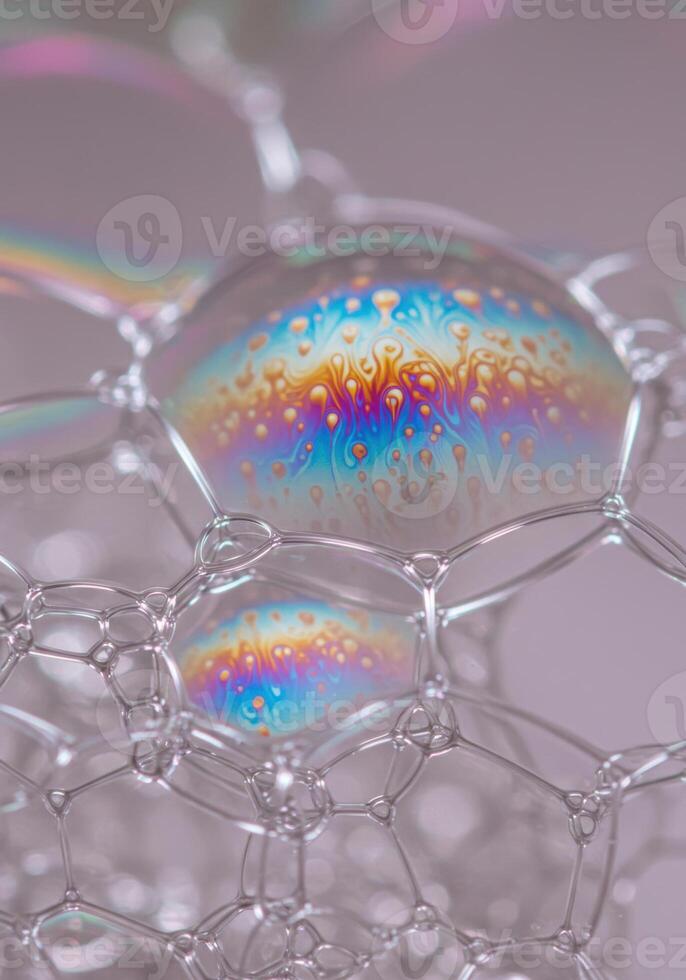Vibrant macro photograph of a soap bubble displaying mesmerizing, rainbow-like colors. photo