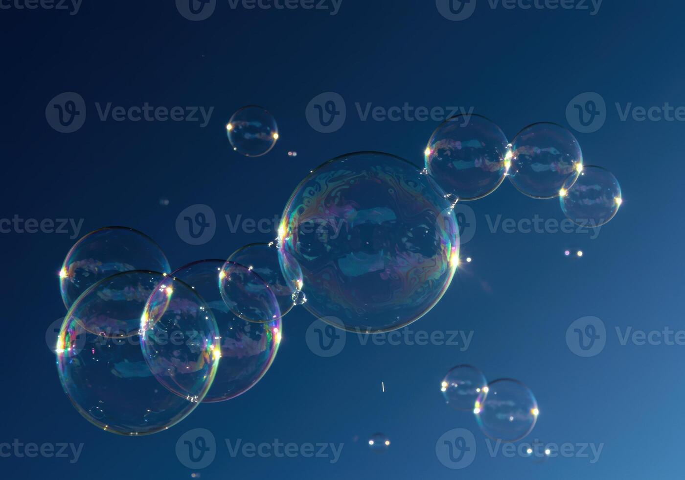 A collection of shimmering bubbles floats gently in the sky, with colorful reflections. photo