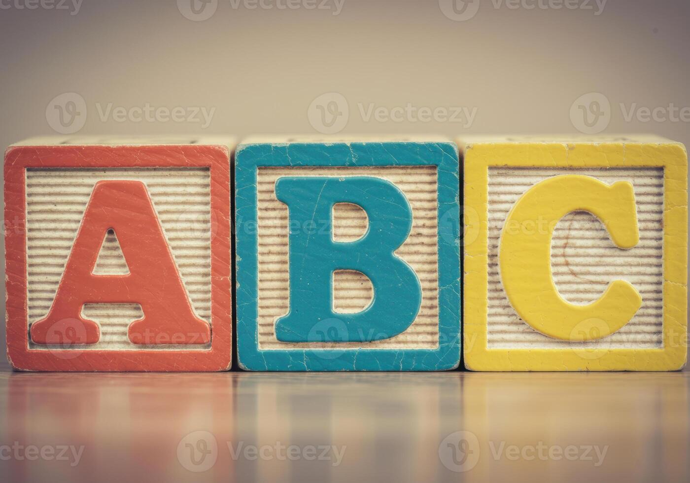 Brightly colored wooden blocks spelling the letters a b c, ready for learning. photo