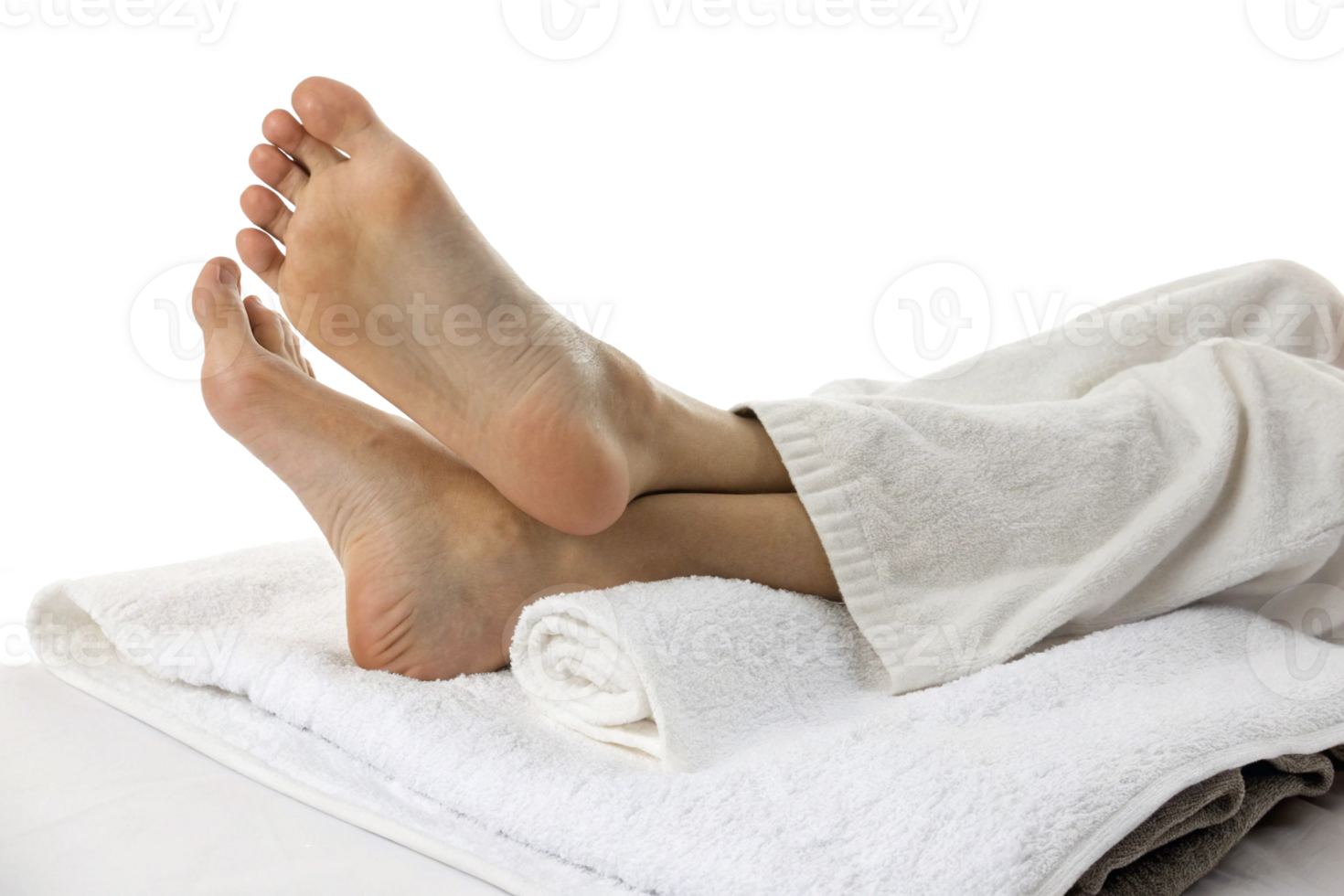 Relaxing spa treatment featuring a pair of serene feet resting on rolled towels. png