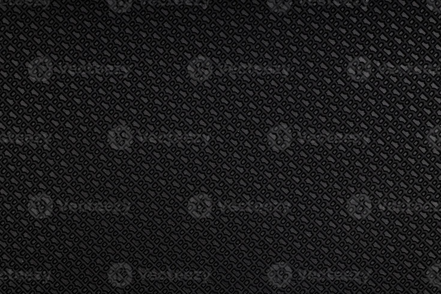 Dark Rubber Surface with Embossed Diamond Pattern photo