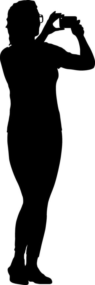 Young woman in glasses taking a photo of an isolated silhouette on a smartphone vector