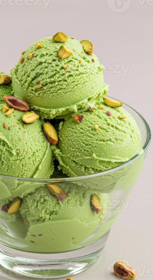 A delightful bowl of pistachio ice cream, garnished with a few nuts. photo