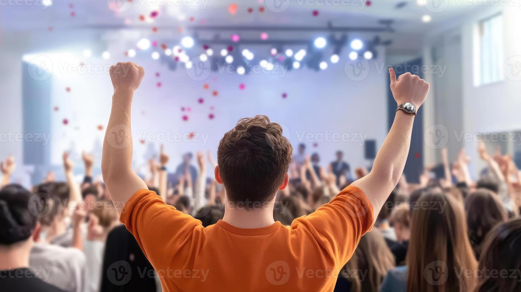 Crowd cheering at a performance, celebrating success and a winning moment photo