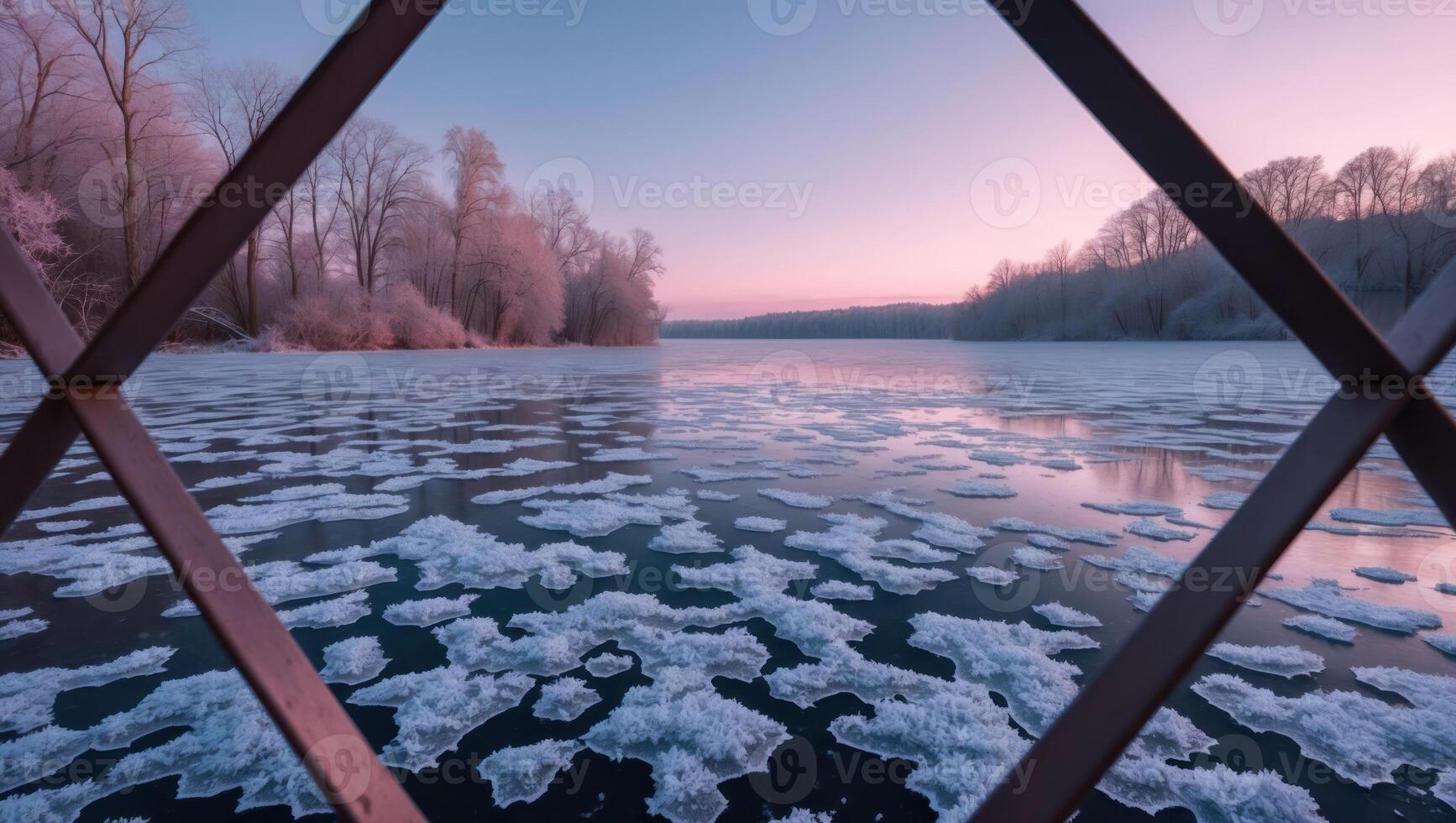 Frozen Lake with Ice Floes and Pink Sky Viewed Through Fence photo
