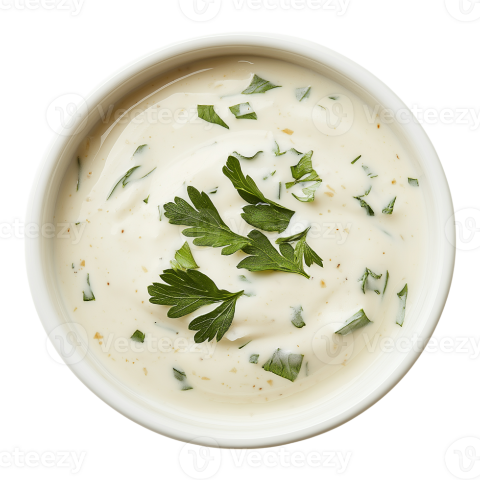 A bowl of white sauce with parsley on top png