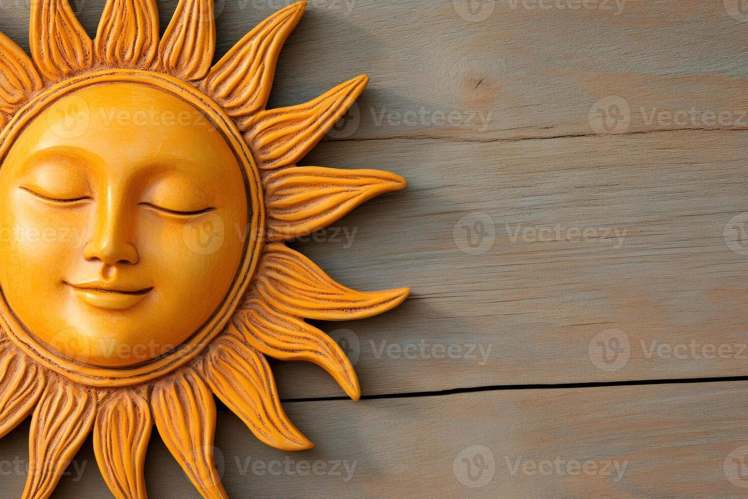 Wooden sun face smiling on rustic wood background representing summer heat photo