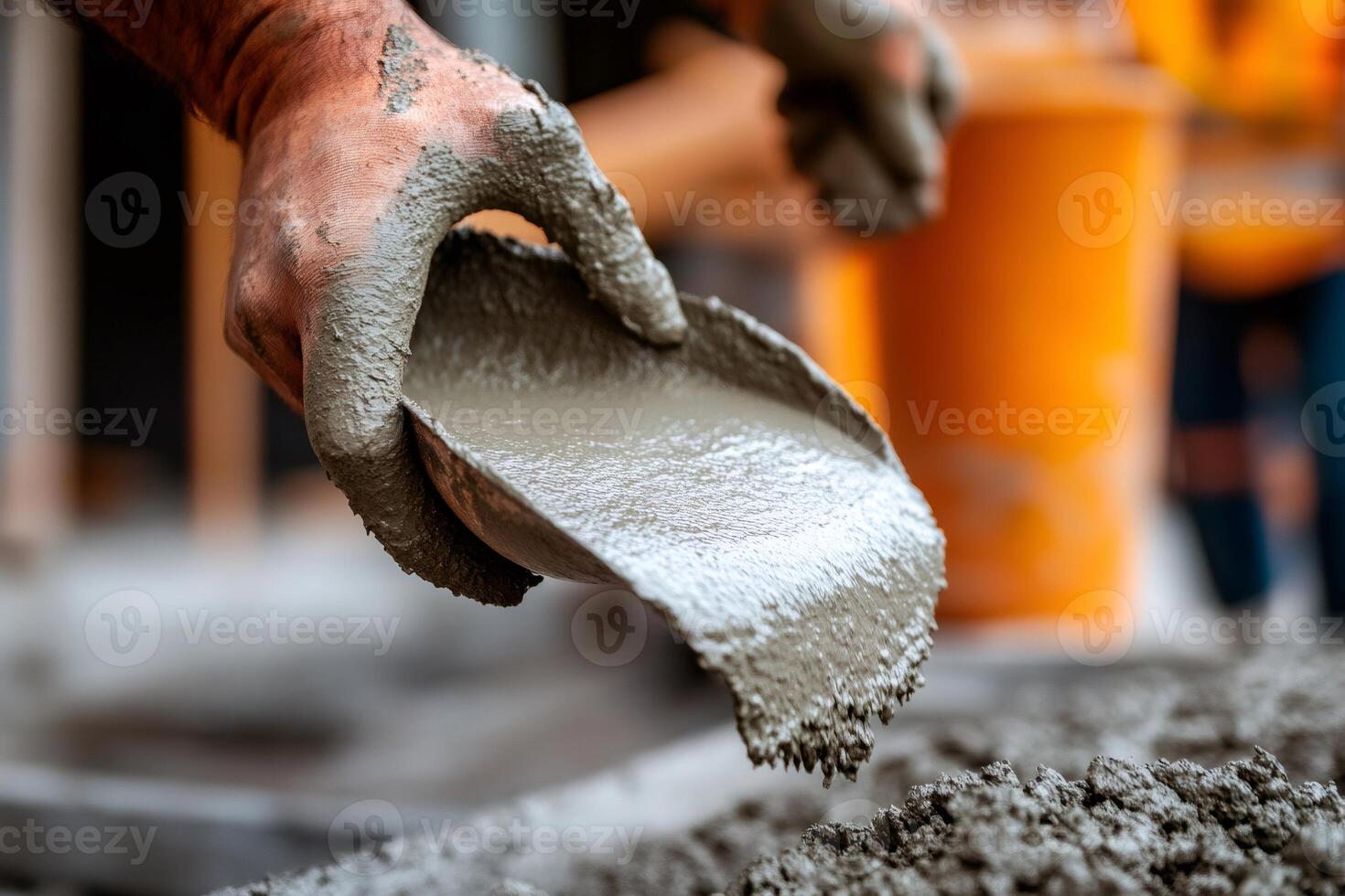 Construction worker pouring fresh concrete mix at building site photo