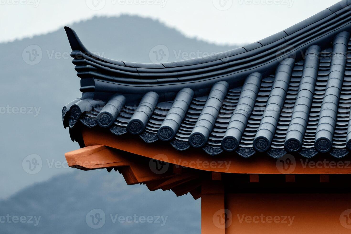 Traditional asian roof tiles creating stunning architectural detail with mountain backdrop photo