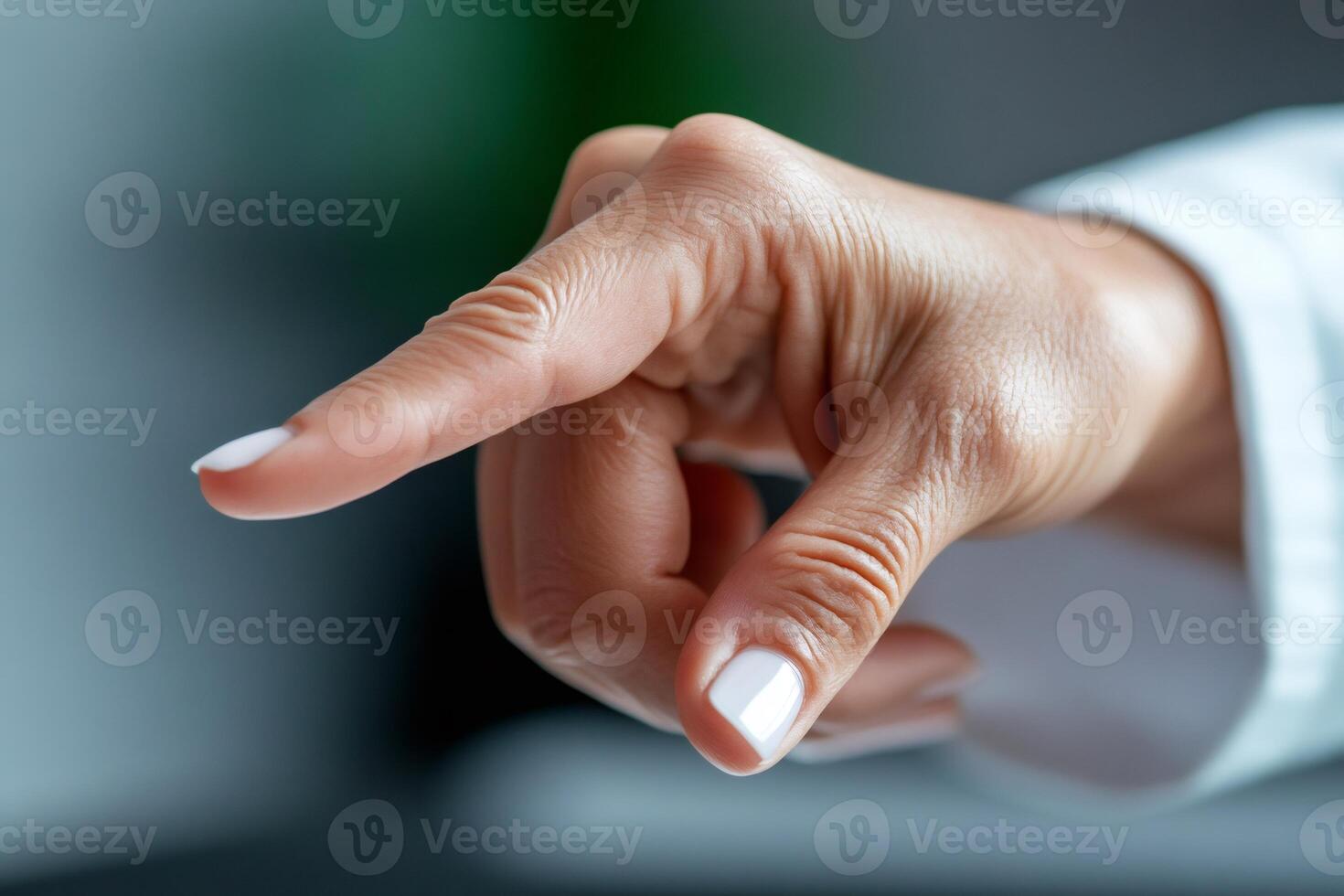 Doctor pointing finger at virtual screen giving instructions photo