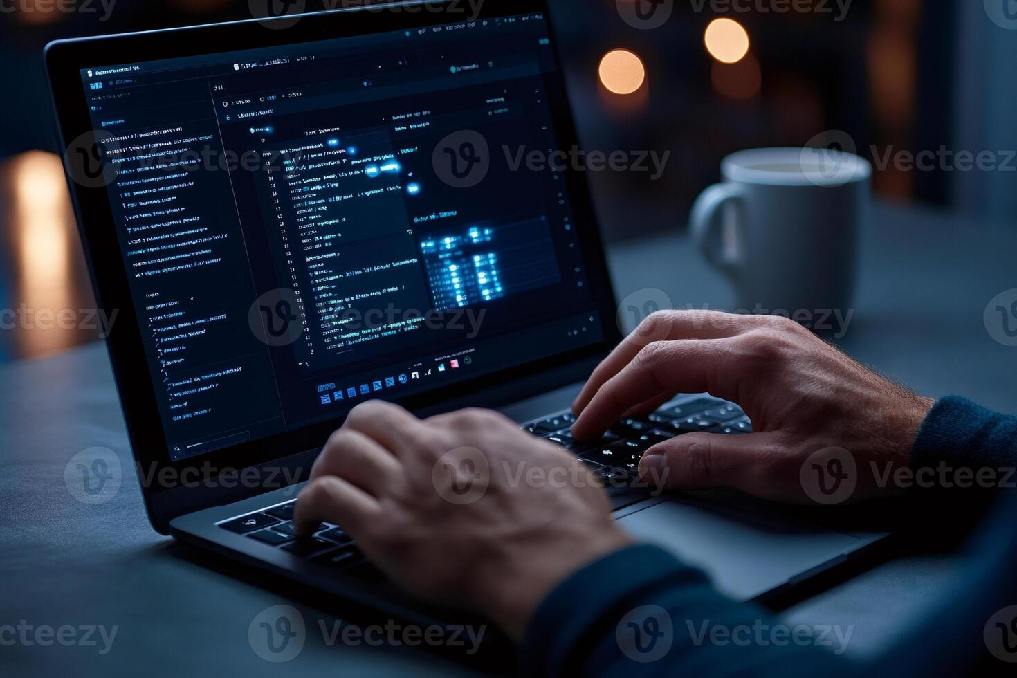 Software developer programming on laptop in dark office at night photo