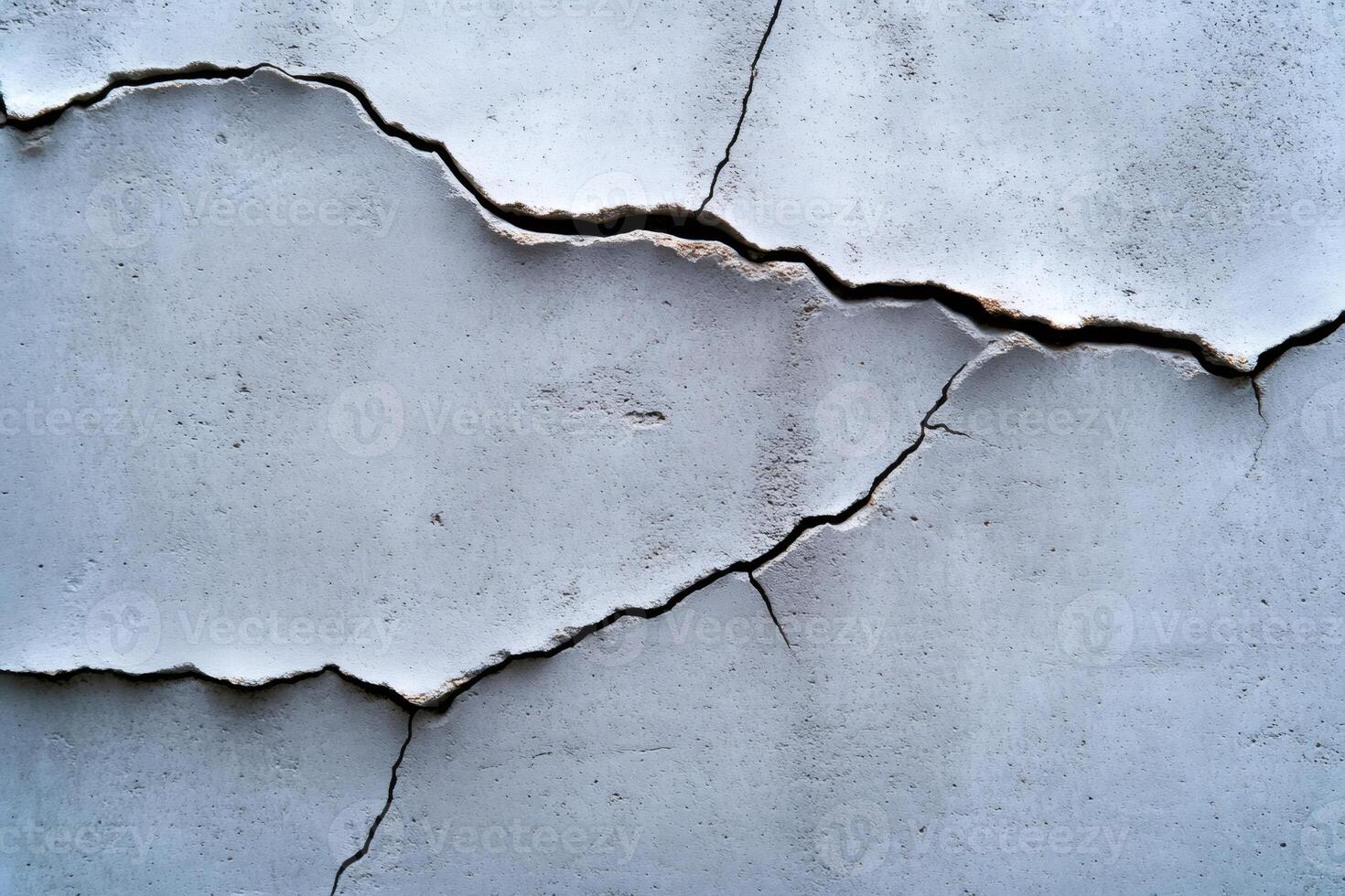 Cracking concrete wall showing signs of deterioration and damage photo