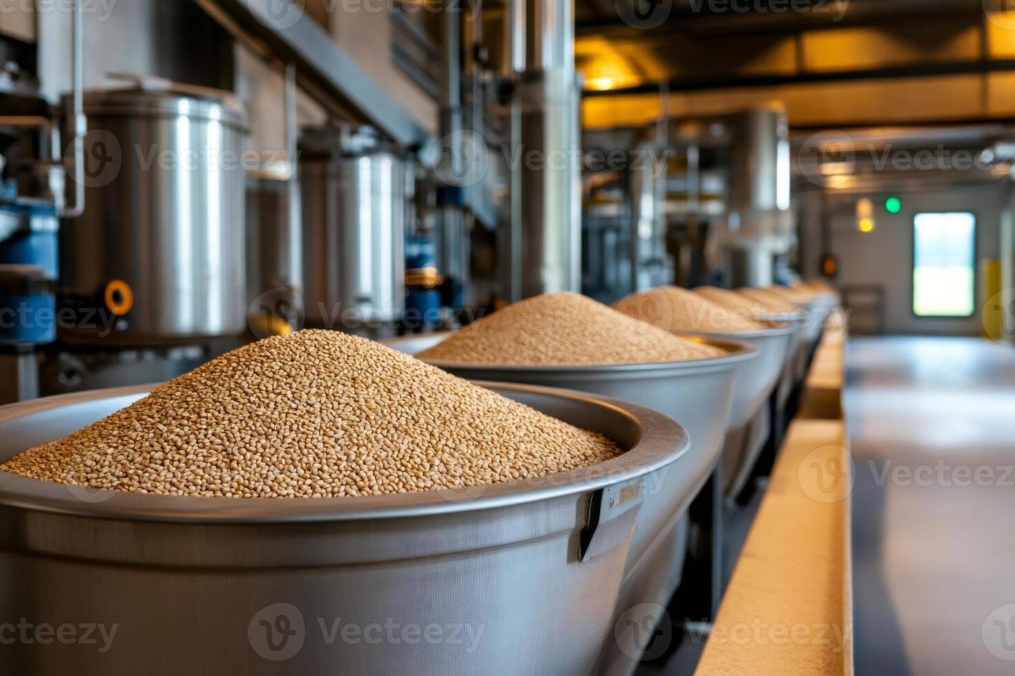 Wheat grains being processed in a food processing plant photo