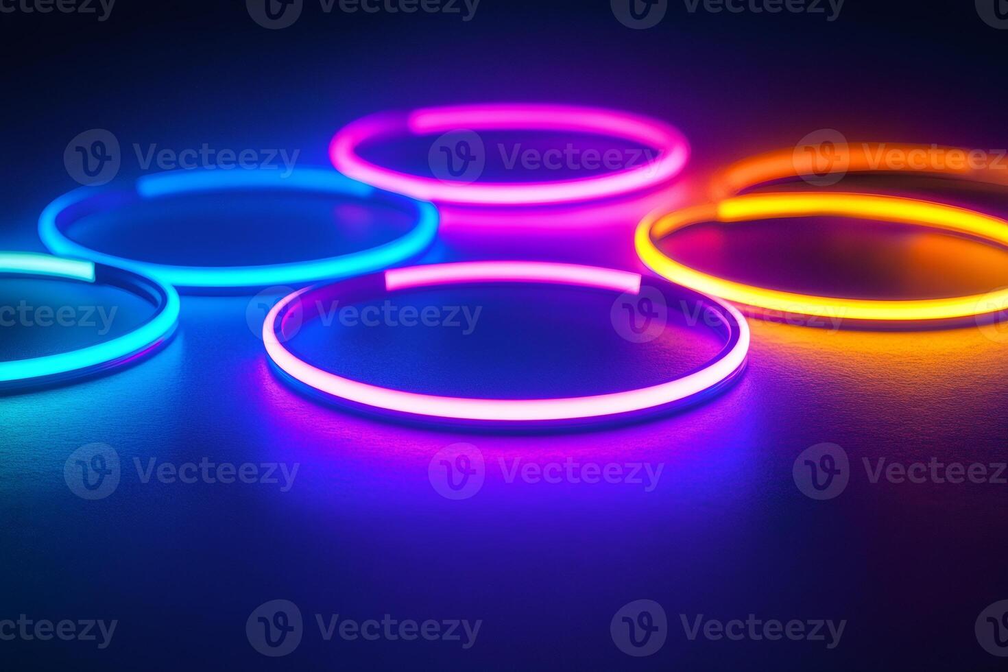 Colorful neon lights creating vivid circles on dark background photo
