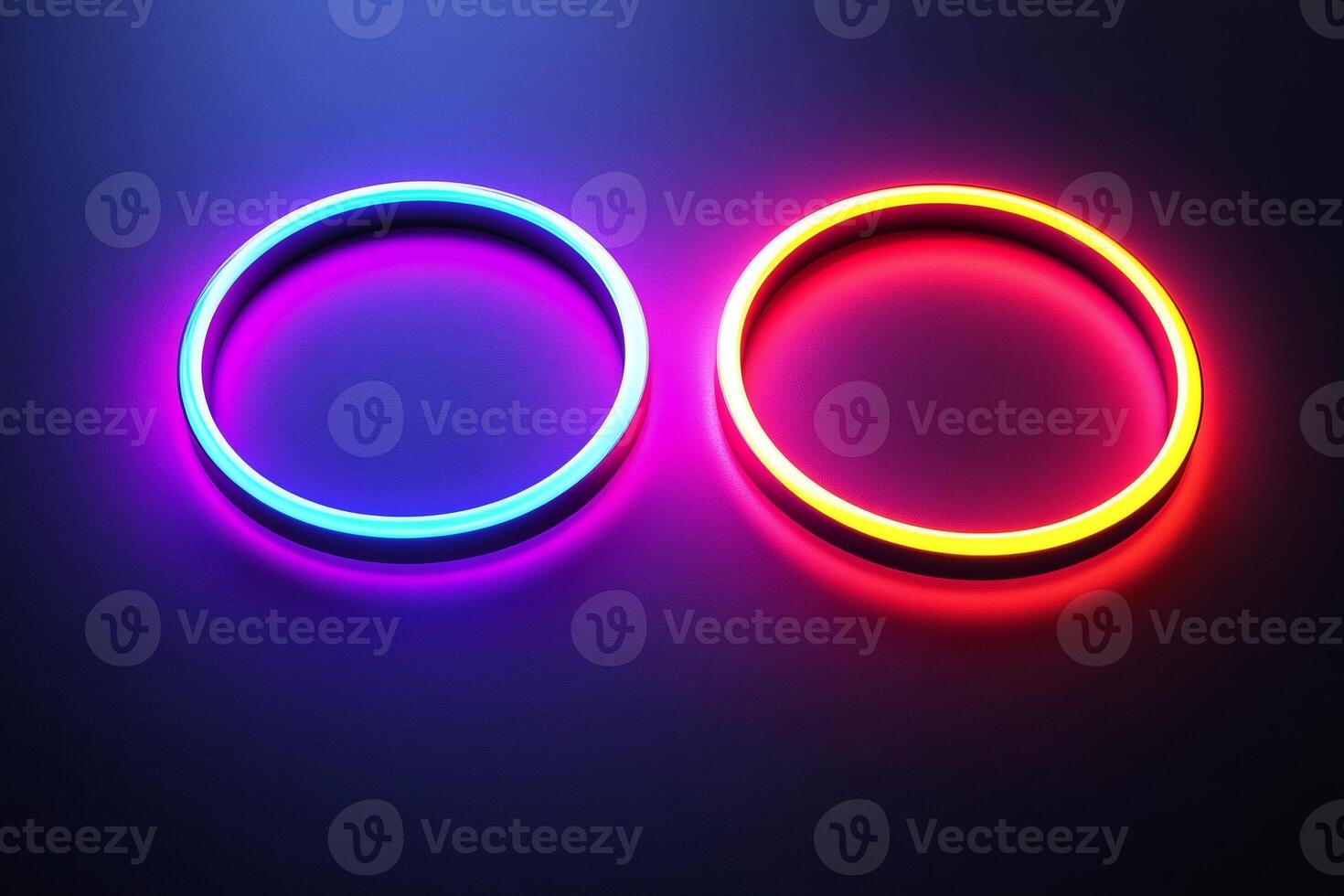 Two glowing neon circles creating vibrant light trails on dark background photo