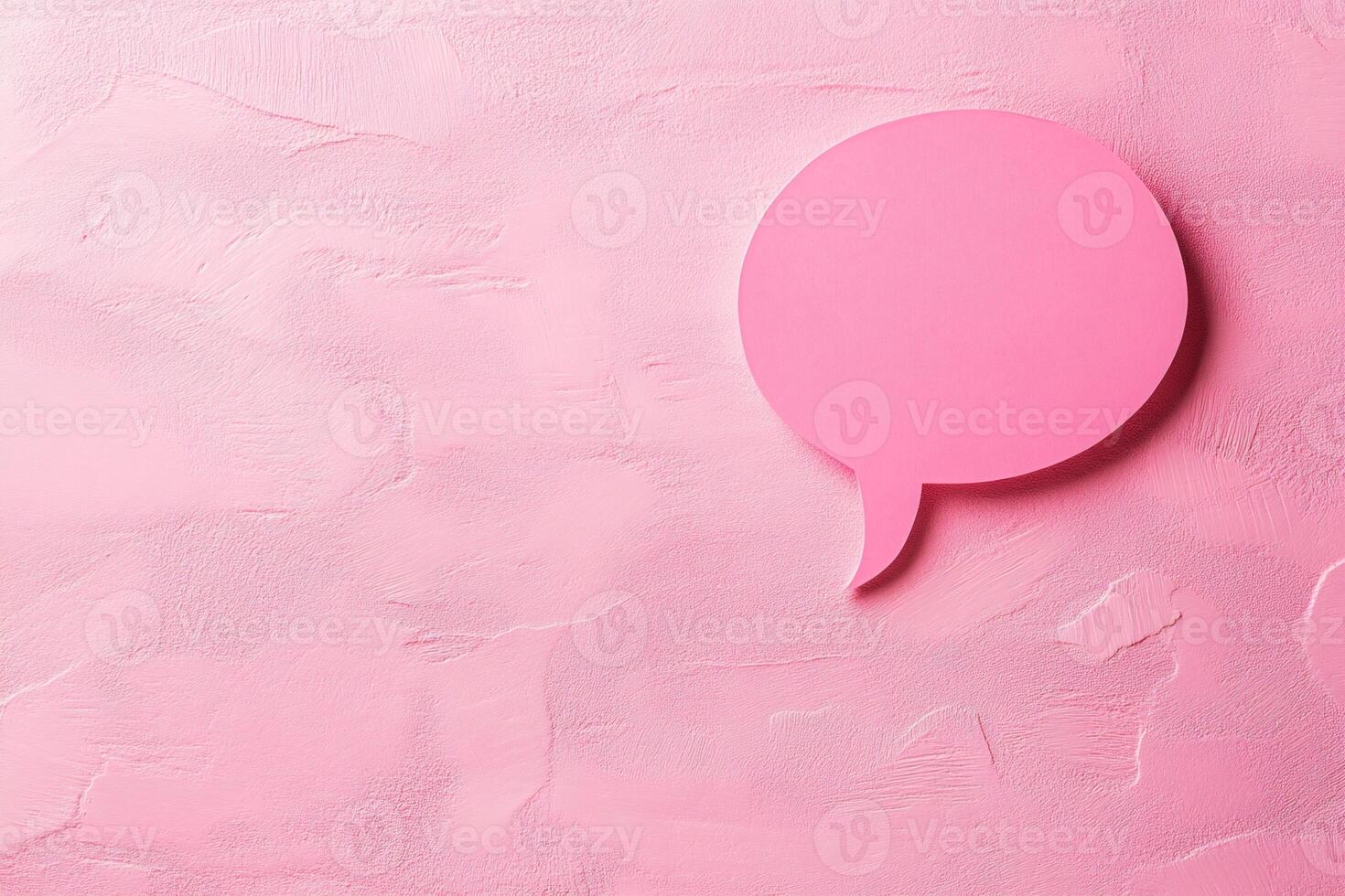 Pink speech bubble communicating on textured background photo