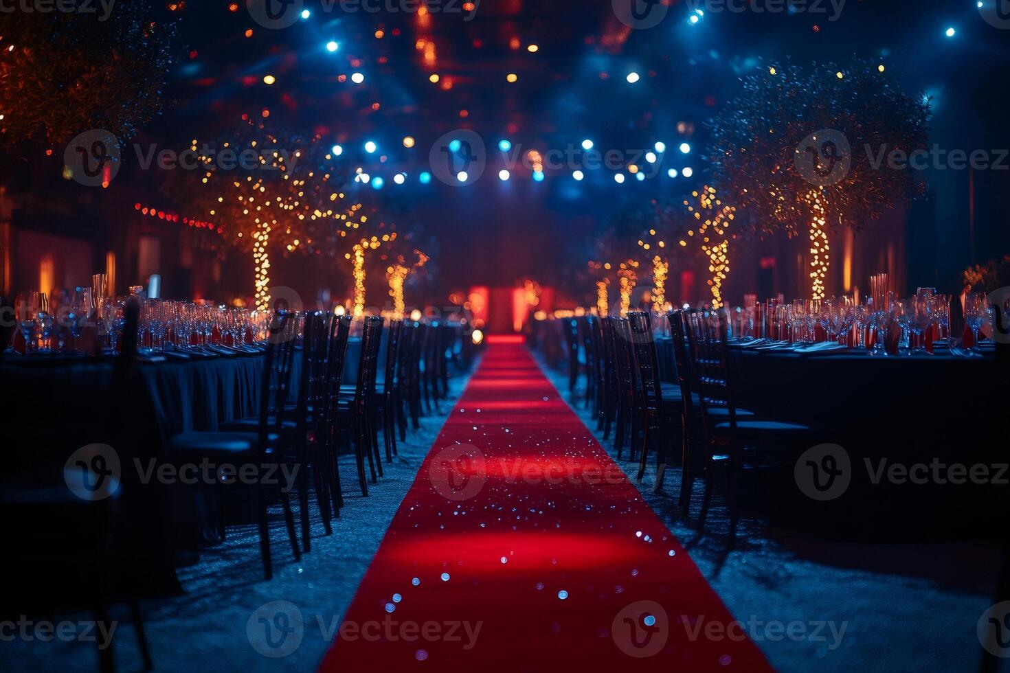 Red carpet leading to elegant dinner tables in festive venue photo