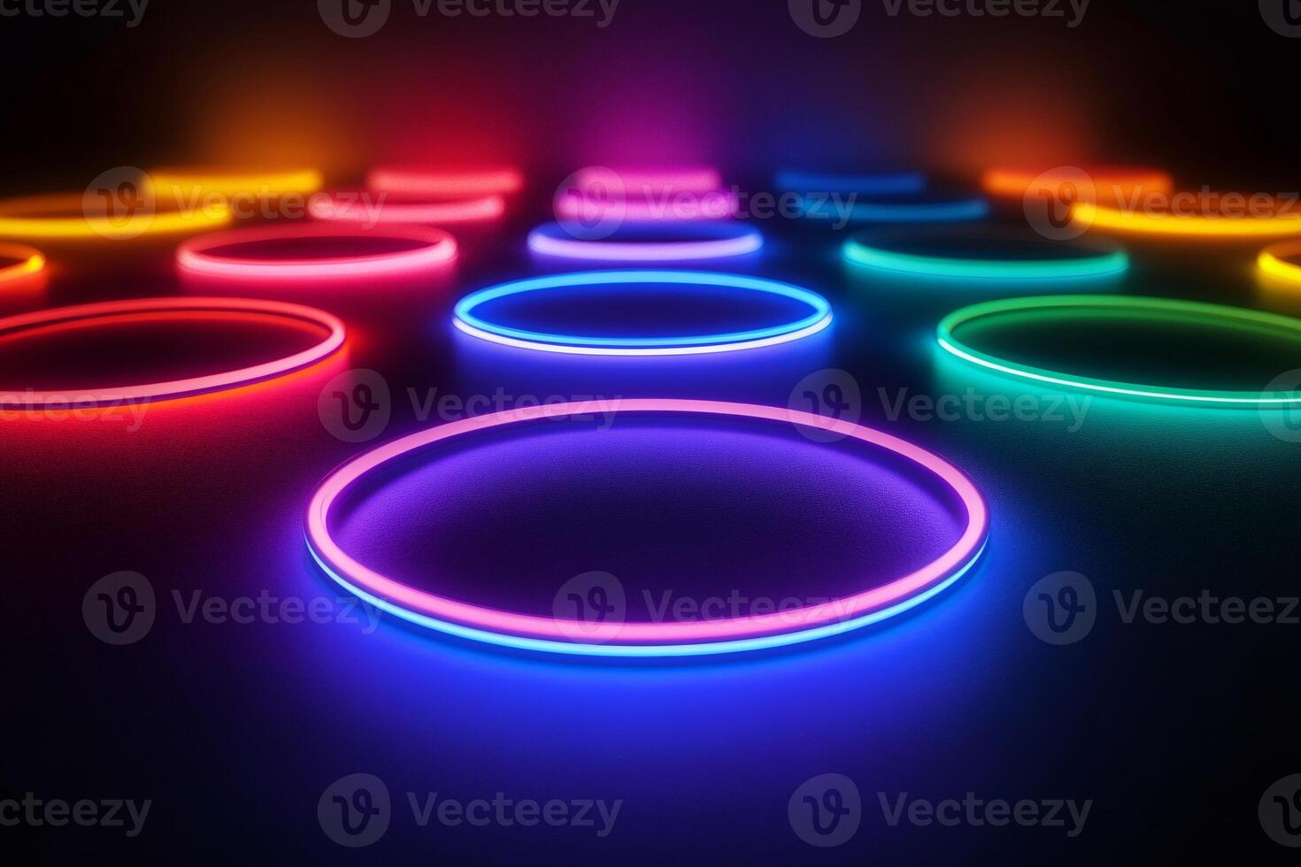 Glowing neon circles creating a vibrant and colorful pattern on a dark background photo