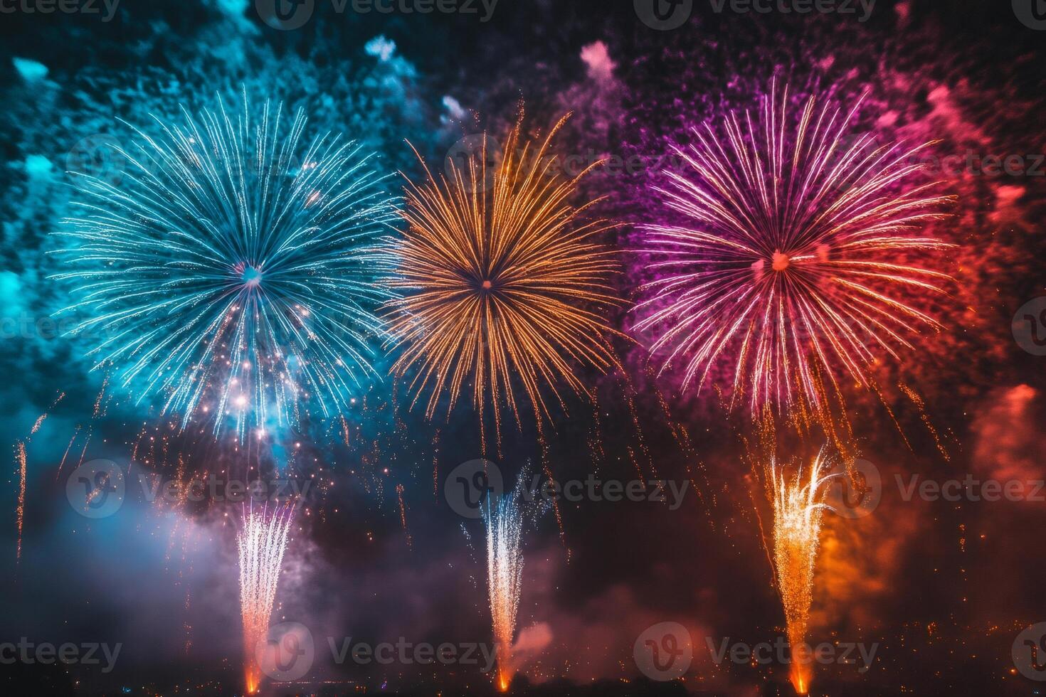 Colorful fireworks exploding in night sky over city celebrating holiday photo