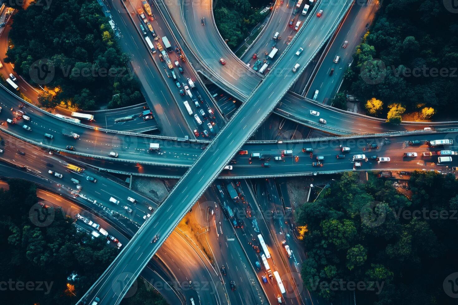Highway interchange traffic flowing during dusk, aerial view photo
