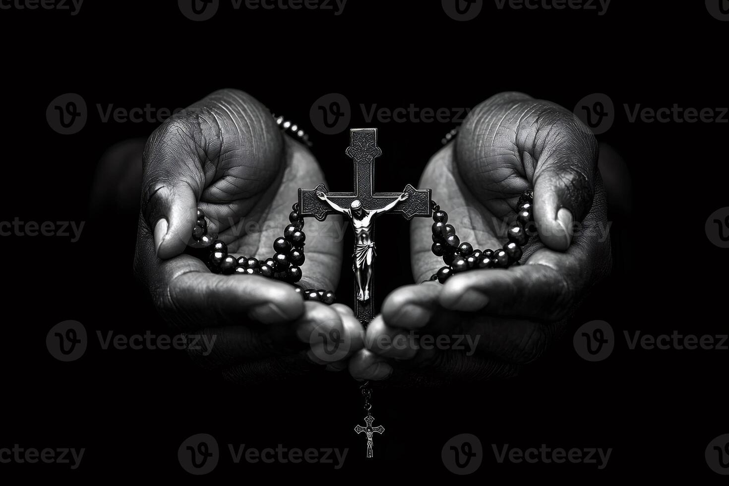 Praying hands holding rosary with crucifix on dark background photo