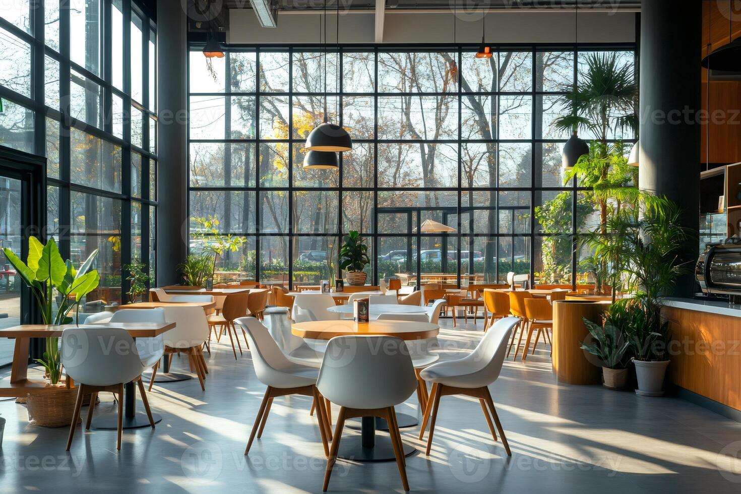 Modern cafe interior design with wooden furniture and large windows overlooking park photo