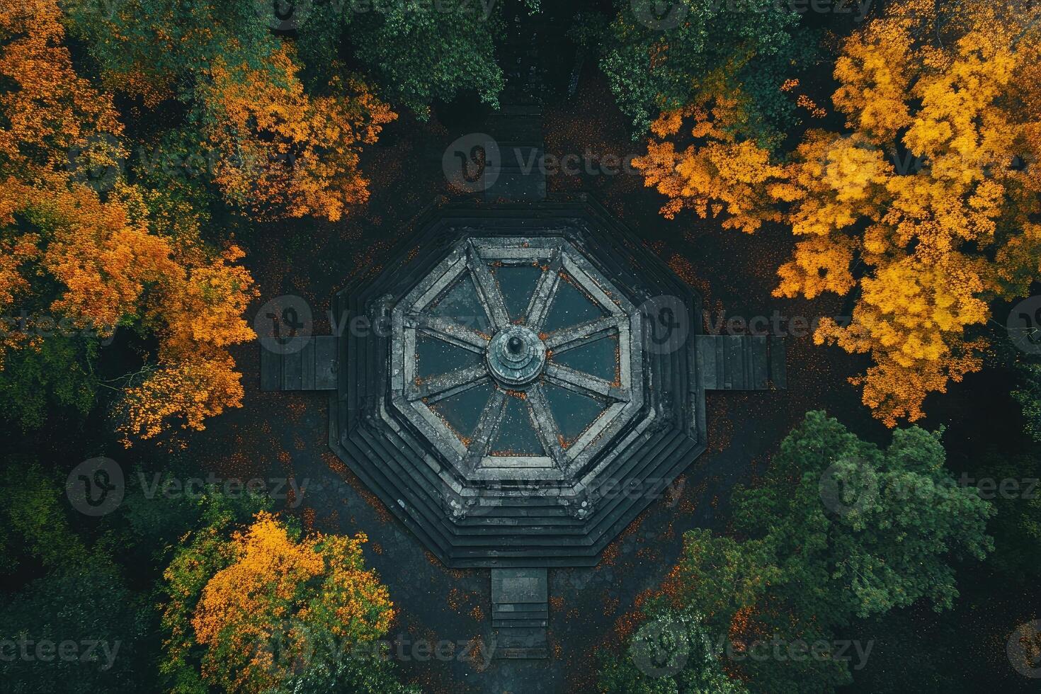 Octagonal pavilion surrounded by colorful autumn trees, aerial view photo