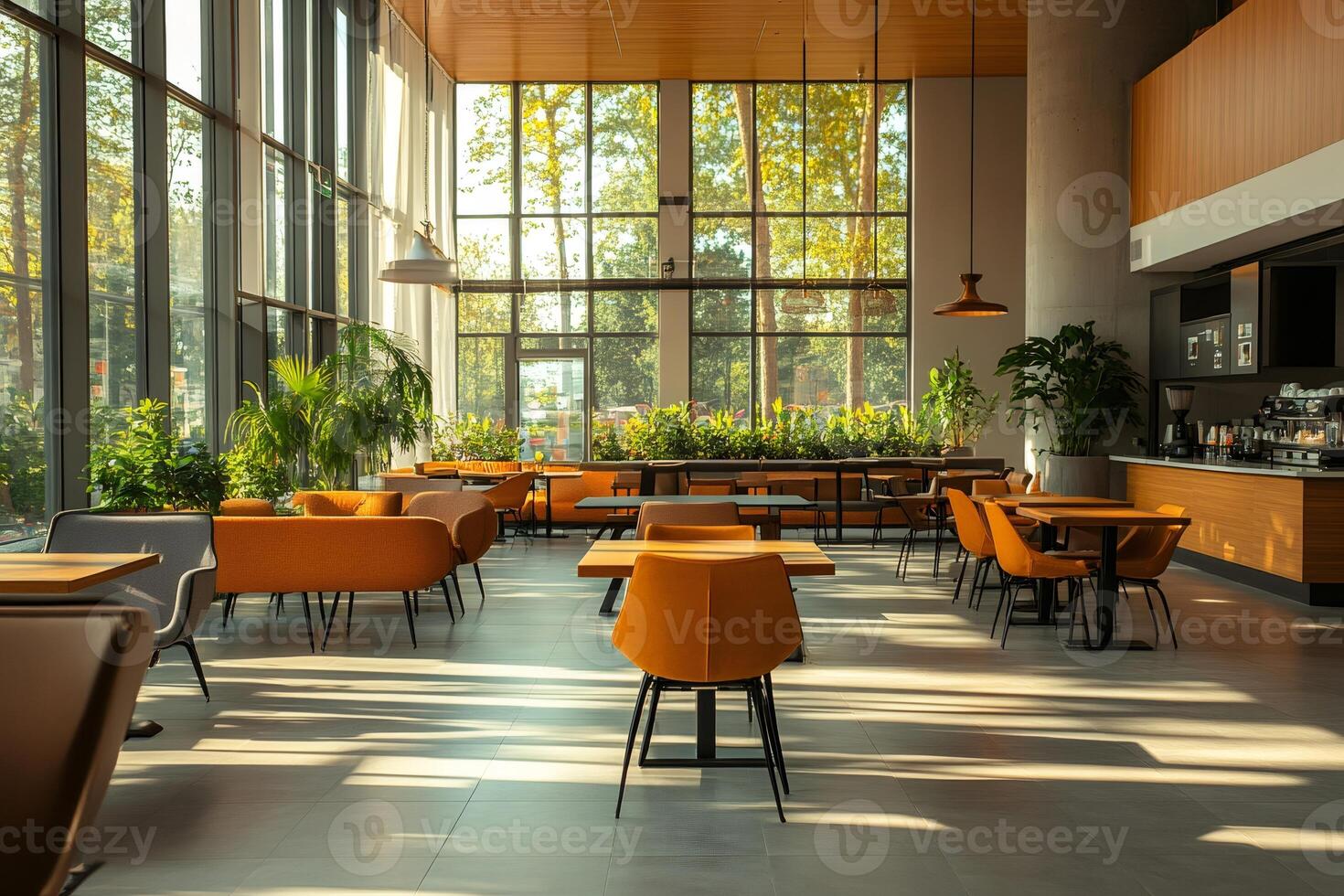 Modern cafe interior design with orange furniture and large windows overlooking trees photo