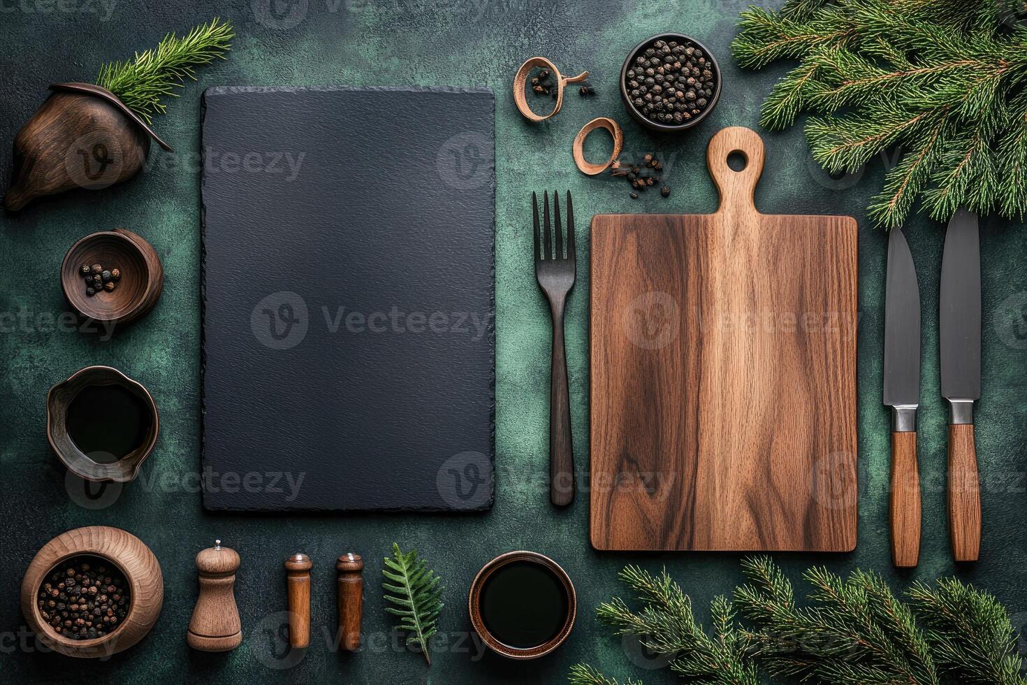Christmas food menu mockup with black slate, wooden chopping board, cutlery and spices on green textured background photo