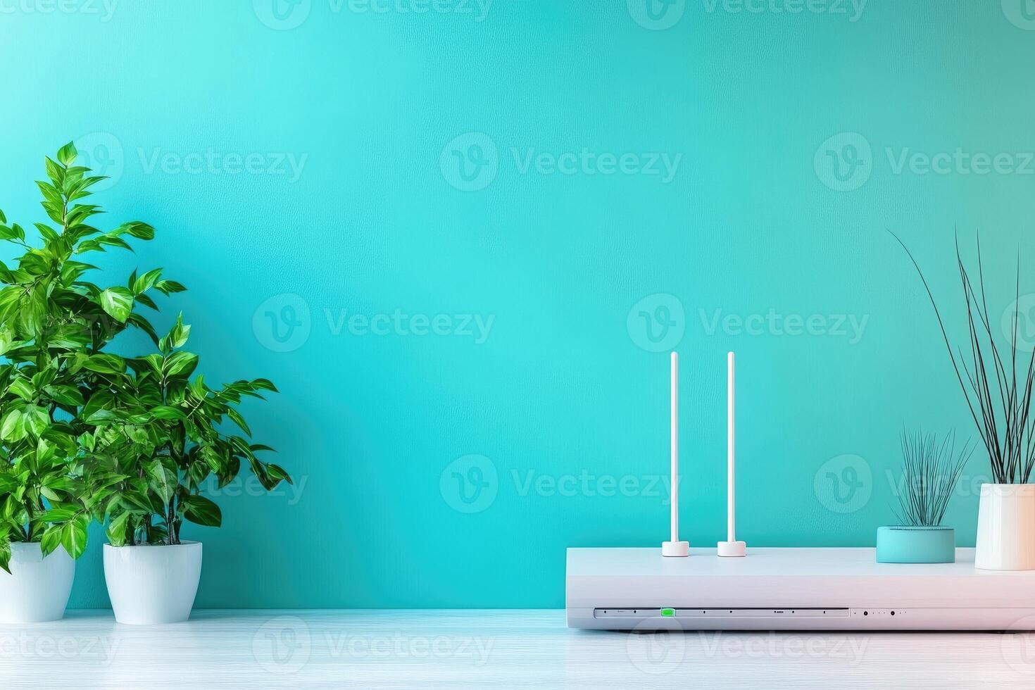 White wireless router on table with plants and turquoise wall background photo