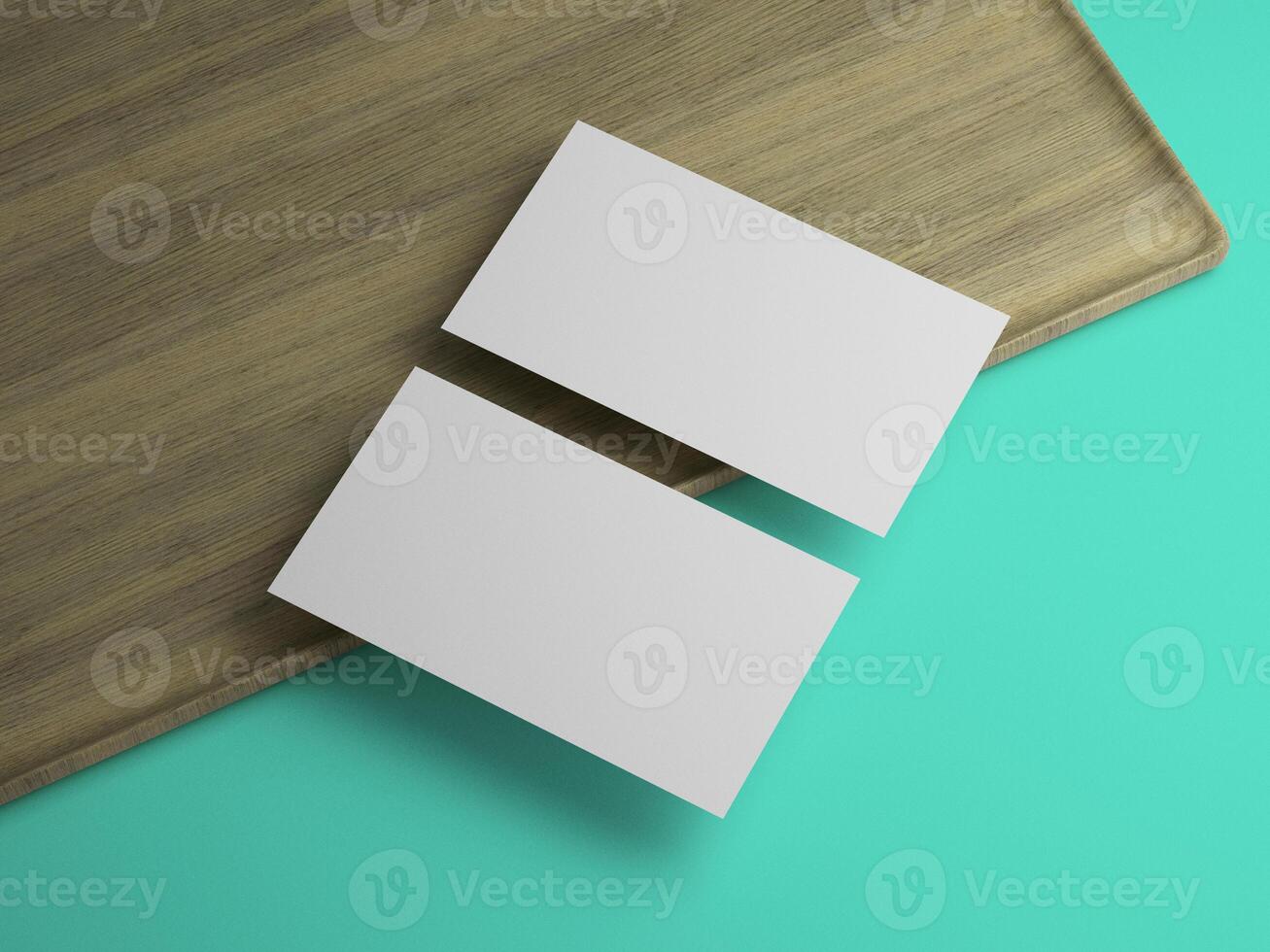 Top view of two blank cards on wood tray with vibrant teal contrast, perfect for mockup. photo