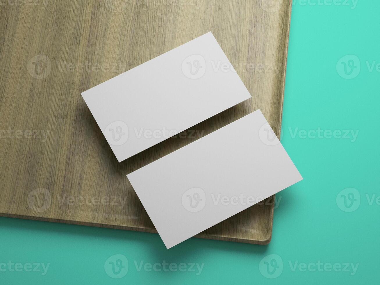 Twin business card mockup on wooden surface, angled composition for contemporary brand presentation. photo