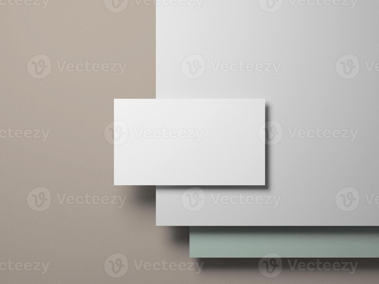 Business card placed on layers of white and soft pastel colors, perfect for showcasing elegant and modern branding. photo