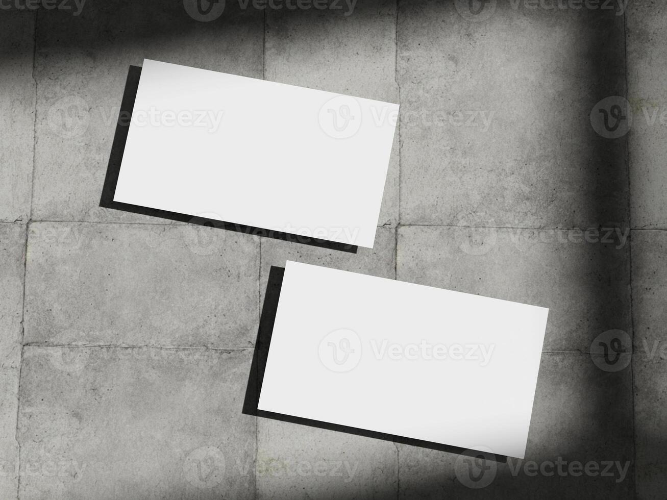 Professional business card mockup on a concrete background, featuring subtle shadows and a minimalist aesthetic. photo