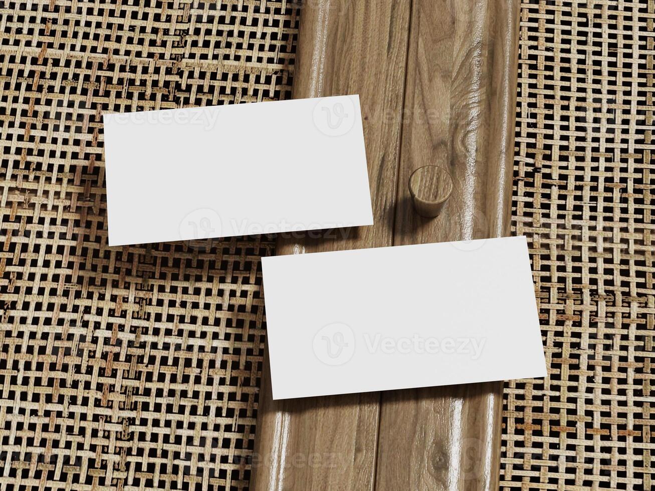 Elegant business card mockup with two blank cards on a rattan surface, framed by a wooden border for a minimalist and professional touch. photo