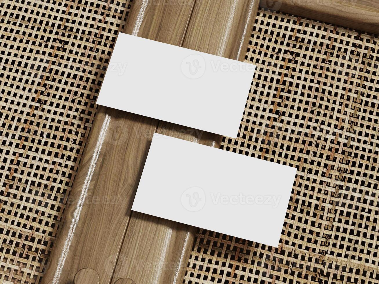 Two blank business cards mockup on a rattan weave background, framed with wood for an elegant and modern presentation. photo