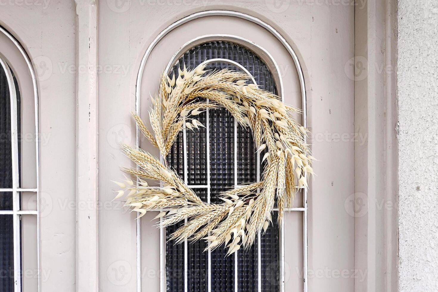 Orthodox Easter wreath decoration made of wheat and oat stalks photo