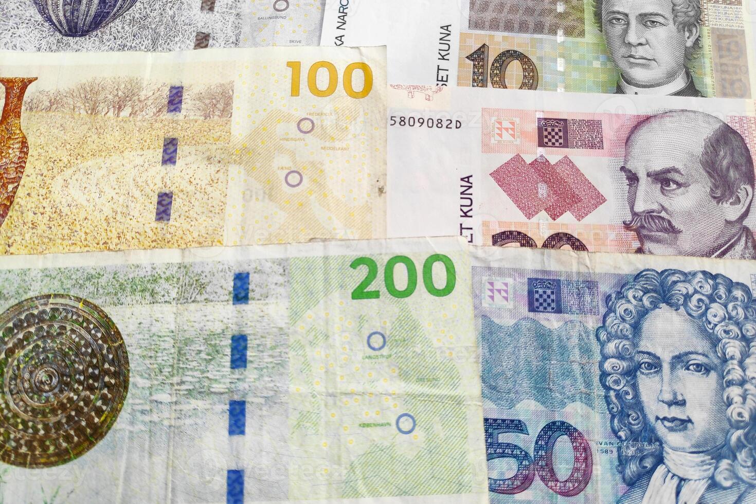 Stack of Danish Kroner and Croatian Kuna photo